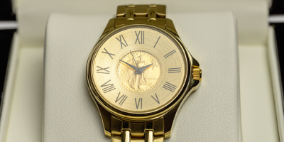 Uw horloge met goudkleurige band en de 1/10 Oz gouden Amerikaanse Eagle 1986